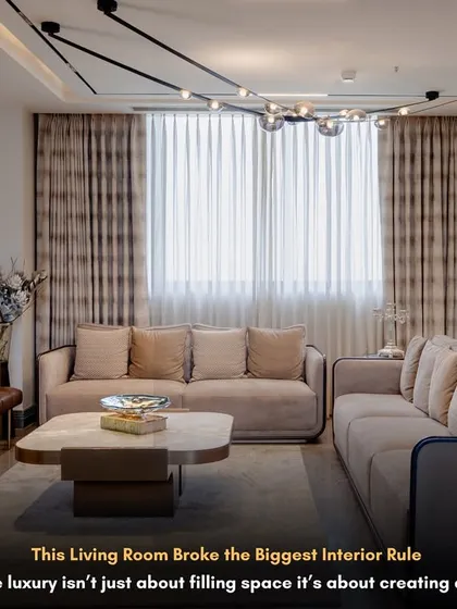 We broke a major interior rule here by mixing different styles, and it worked beautifully. This living room combines modern furniture with a classic, hand-painted wallpaper, creating a space that is unique and full of character.