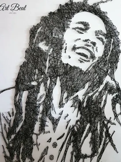 This Bob Marley portrait was created entirely with nails and a single continuous black thread. String art is a meticulous process, but it creates a stunning, graphic effect with amazing depth.