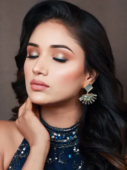 A close-up on the soft, shimmery eye makeup from this photoshoot. The blend of neutral and sparkling shades creates a sophisticated and glamorous effect.