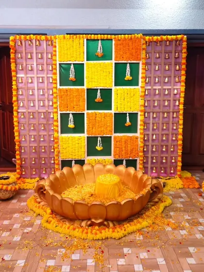 The full setup for the Haldi ceremony, including the lotus-shaped seating.
