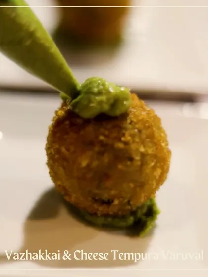 A Vazhakkai & Cheese Tempura Varuval, another innovative bite from the Chettinad menu that combines traditional flavors with a modern twist.