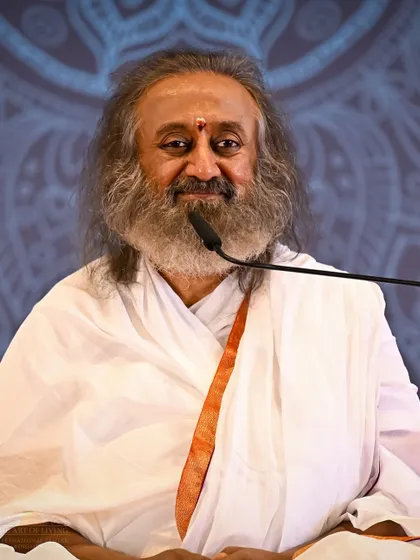 A candid shot of me speaking during the Patanjali Yoga Sutras discourse. Over 7,000 seekers gathered to immerse themselves in this unforgettable journey into consciousness, where knowledge and meditation weave together.