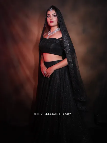 For a modern reception, a sparkling black lehenga paired with a brilliant CZ necklace set is a showstopper. The sheer dupatta adds a touch of drama and elegance.