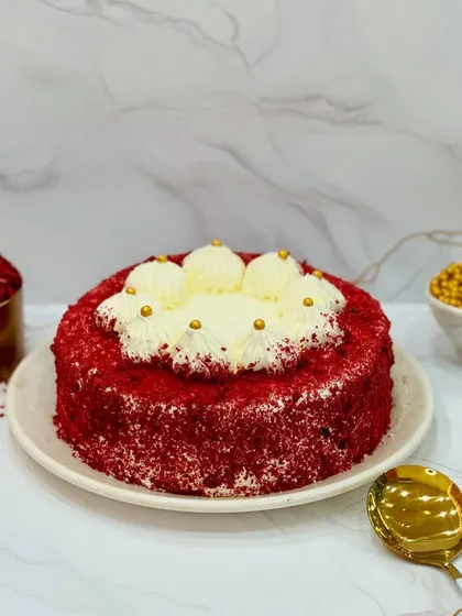 Dive into the cheesy and spongy taste of my Red Velvet cake. This professionally shot image shows the perfect slice, revealing the moist layers and creamy frosting that make this cake a bestseller.