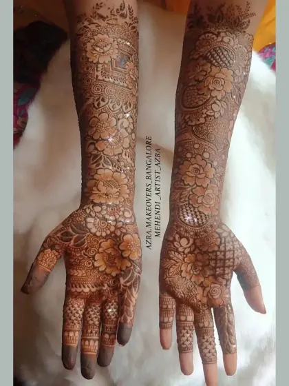 This design combines different floral styles with net patterns for a unique and modern bridal look.