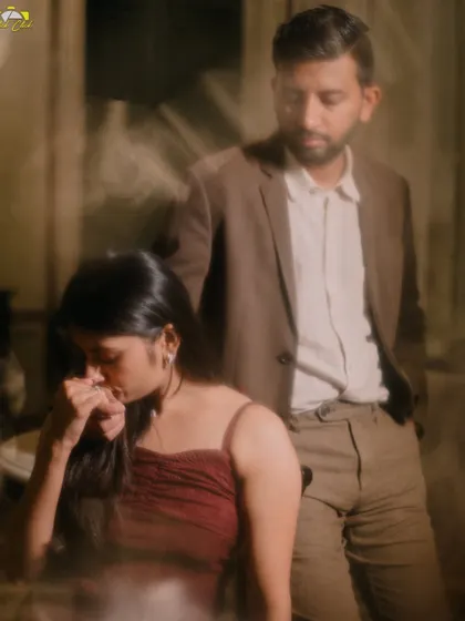 An artistic, moody shot with motion blur, capturing a quiet, contemplative moment between the couple in Pondicherry.