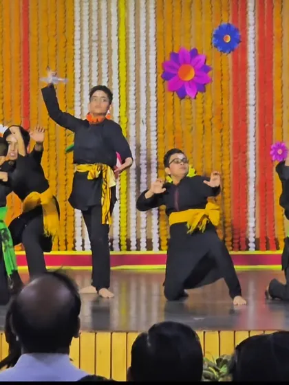 A group of young boys in a dramatic pose during their school's stage performance. I choreograph pieces that are both age-appropriate and true to the spirit of the dance form.