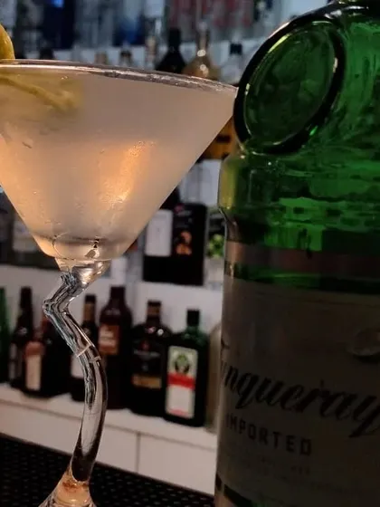 A classic Gin Martini with a lemon twist, served in a unique Z-stem glass. We pay attention to every detail, including glassware.