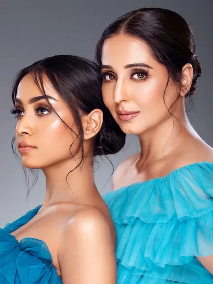A beautiful dual portrait of makeup artists Chandni Singh and Sneha Sharma with model Niharika. This image captures a moment of mentorship and collaboration between leading industry professionals.