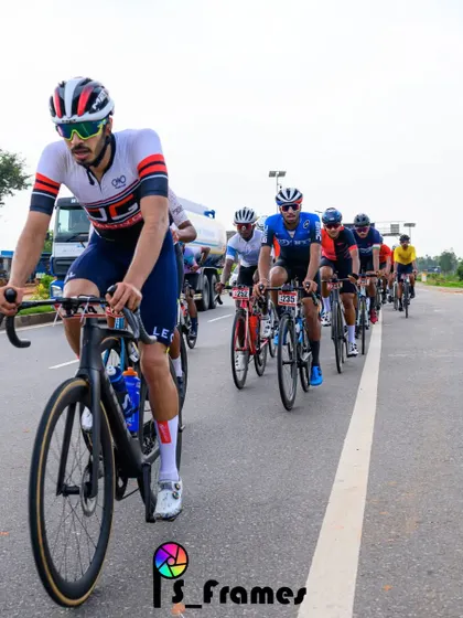 An elite rider, leading the peloton in a long and grueling race.