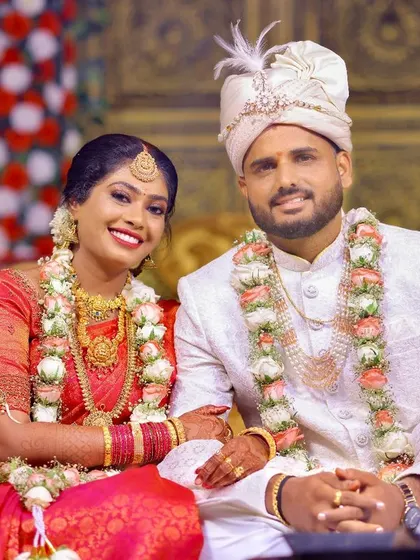 A happy couple portrait from their wedding day, perfect for the main page of a wedding album.