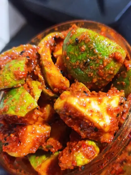 A close-up of my classic Mango Pickle, made with fresh, raw mangoes and a traditional blend of spices. You can see the quality and texture that comes from a truly handmade process, with no artificial colors.