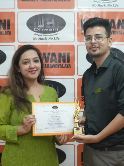 An adult student receives her award, proving that it's never too late to learn and achieve.