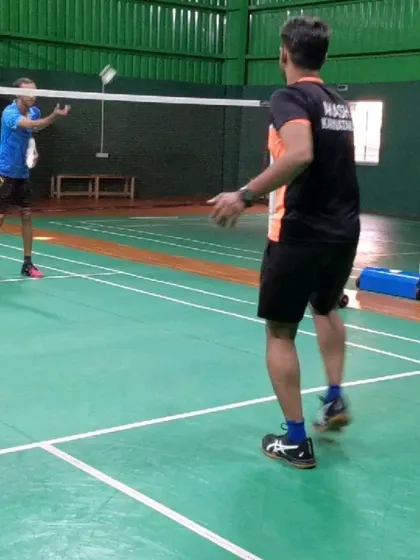 Here is a snapshot of a live coaching moment. A player practices their net play while our coach provides feedback on technique and positioning for a cross-court lift.