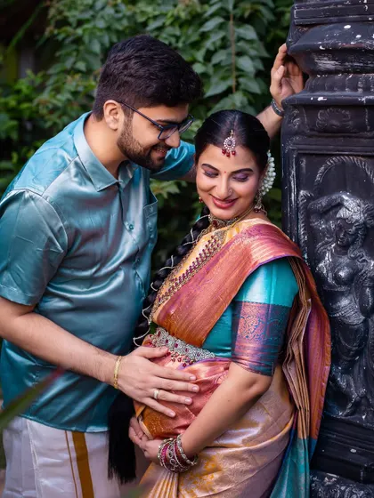 A duplicate of image 31, this photo captures a tender moment between the couple. The focus on their interaction and the baby bump makes it a heartwarming addition to any maternity album.