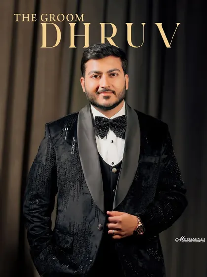 A dapper portrait of the groom, Dhruv, in his sequined tuxedo. This classic shot highlights the groom's style and confidence on his engagement night.