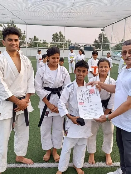 A proud moment as a student receives his official black belt (Shodan) certificate, sent all the way from the WSKF headquarters in Tokyo, Japan. This is the culmination of years of dedication.