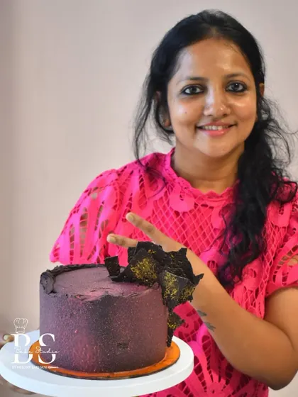 Another beautiful example of a student's work, this ganache cake features a unique textured finish and abstract chocolate shards.