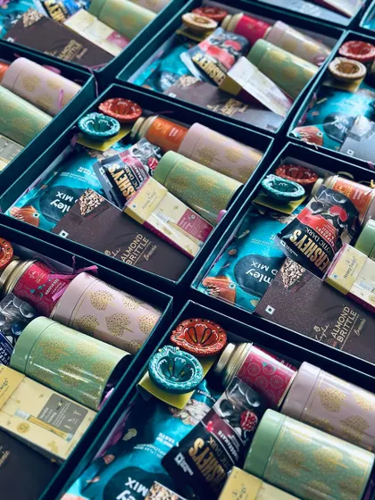 Rows of our corporate Diwali hampers being assembled, demonstrating the scale of our operations and our attention to detail.
