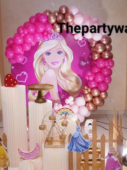 A close-up of the Barbie-themed backdrop, showing the vibrant colors and details that make the party feel extra special.