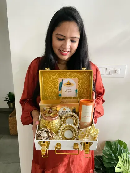 Our founder, personally overseeing and showcasing one of our premium metal trunk hampers, reflecting our hands-on approach to quality.