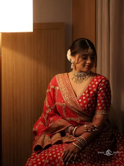 Another seated portrait, capturing a moment of quiet reflection. These are the calm moments before the celebration begins.