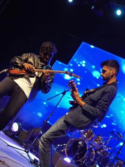 My guitarists owning the stage at AFMC Pune. Our sound is a true fusion, where the power of rock guitar meets the intricacies of Carnatic raagas.
