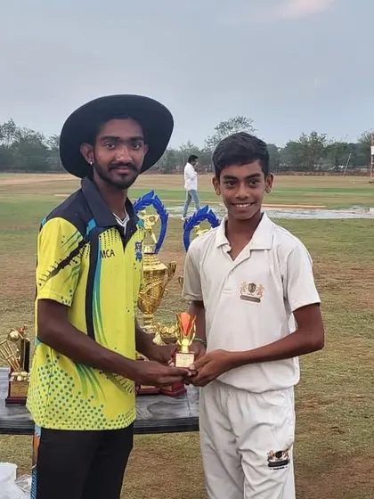 A player proudly accepts his trophy during the prize distribution ceremony on our Hyderabad tour.