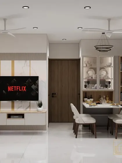 This is a compact living and dining area designed for a modern apartment. We used a light color palette, reflective surfaces, and clever furniture placement to make the space feel bright and spacious.