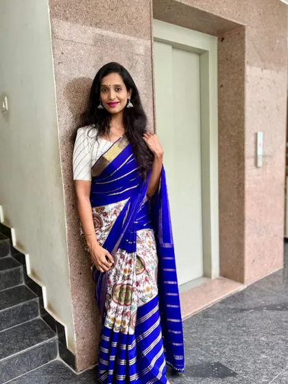 "Loved the combo." Our client looks stunning in this pure Mysore crepe saree with a Pen Kalamkari print. The on-time delivery of her custom blouse made her happy.
