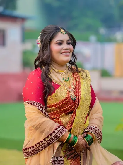 A joyful bride in a beautiful outdoor setting. The makeup is designed to look stunning in natural light.