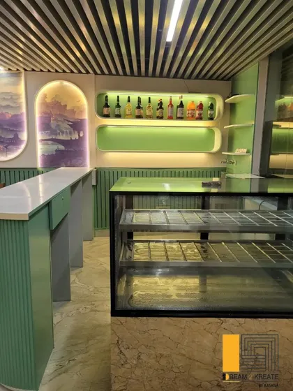 A close-up of the bar area at Rigo Restaurant, showing the custom shelving and display.