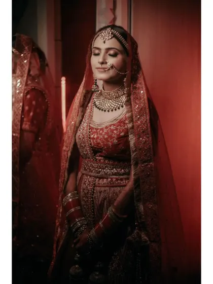 Another beautiful portrait of Vaishali, her reflection in a mirror adding depth and a touch of glamour.