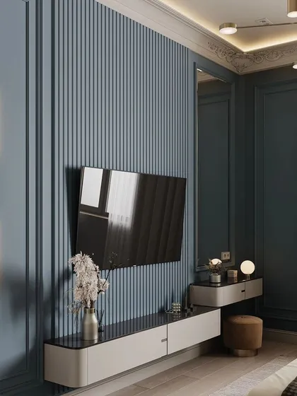 This render shows the TV wall and vanity area of the blue bedroom, featuring a fluted wall panel and modern lighting.