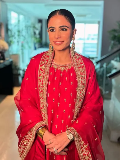 A smiling portrait of Minal. Her morning makeup look was all about fresh skin and defined eyes, ensuring she looked and felt her best for the daytime ceremony.