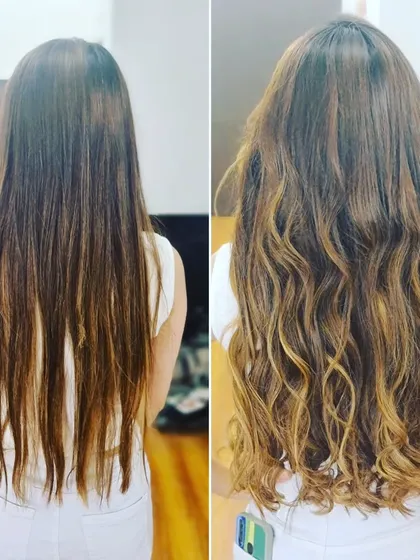 Another look at this gorgeous highlighted transformation, showing how the curls enhance the different tones in the hair.