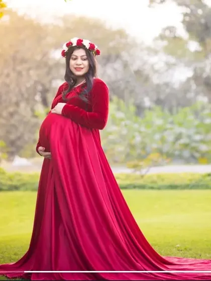 My "Velvet Valentine" gown in a rich maroon shade is perfect for maternity shoots. The combination of velvet and satin gives it a luxurious feel, and the long trail adds a touch of drama.