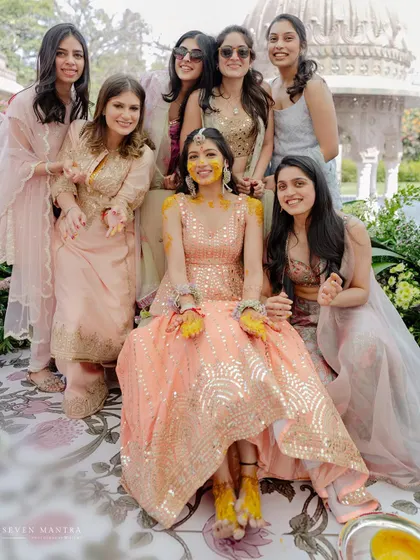 The bride with her squad. A beautiful portrait of friendship and support during the Haldi ceremony.