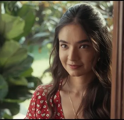 A shot of the female lead from The Man Company film. Her red floral dress adds a touch of romance and softness to her character.