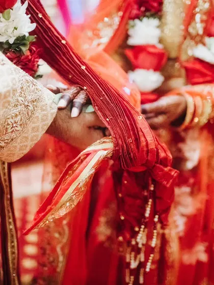 A close-up shot of the Gathbandhan knot, symbolizing the eternal bond between the bride and groom.