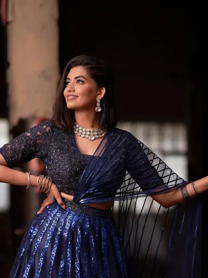 This image shows how the structured dupatta and detailed blouse come together to create a chic, contemporary silhouette. It's a perfect choice for a cocktail party or a modern wedding reception.