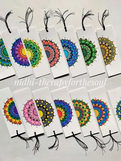 Two rows of vibrant, hand-painted mandala bookmarks. I started my art journey five years ago by making these, and it's always a joy to return to them.