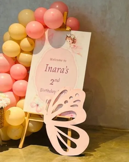 Personal touches make a party unforgettable. Here is a custom welcome sign we created for Inaara's butterfly-themed party, complete with a matching cutout and a sweet fairy graphic to greet the guests.