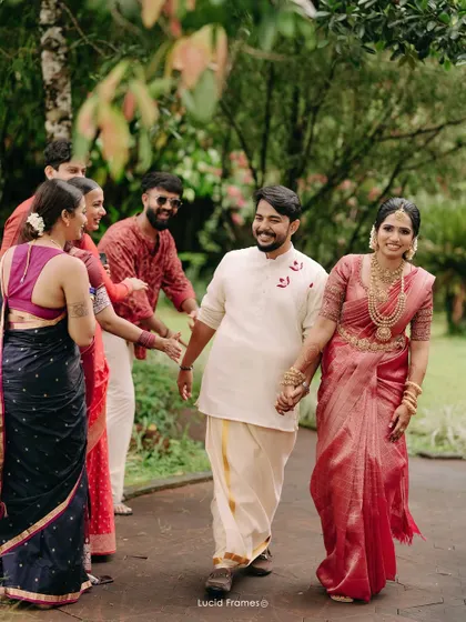 The couple walks hand-in-hand, greeted by their cheering friends. We capture the energy of the entire celebration.