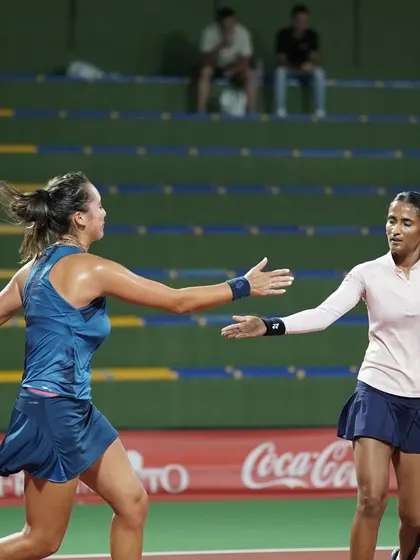 Reaching for a high-five, a small but important gesture of partnership and support on the court.