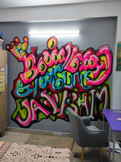 This is the hero piece for my daughter's bedroom, a bold graffiti mural that reads "Kanmani Anbodu Jai Bhim" (With love, my precious, Victory to Bhim). It combines my love for Tamil script, vibrant spray paint art, and our family's belief in Dr. Ambedkar's ideals. This is how I transform a personal space into a powerful statement wall.
