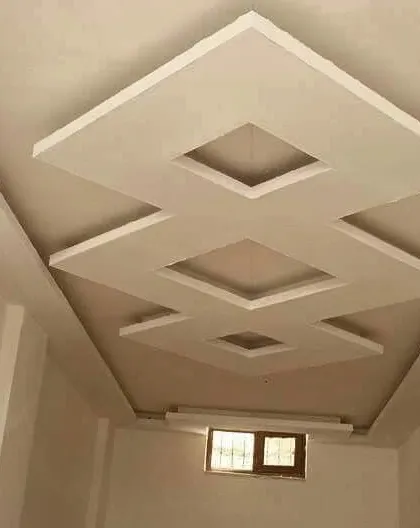 A multi-level geometric design in a raw, unpainted state. This type of design adds a lot of architectural interest to a simple room.