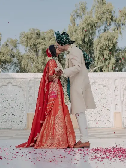 A celebratory kiss right after the ceremony, a perfect moment of love and happiness. We are always ready to capture these spontaneous and iconic wedding day moments.
