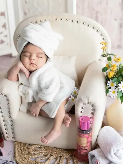 A day at the spa for the newest VIP. This fun and creative newborn setup includes a tiny bathrobe, makeup props, and a look of pure relaxation.