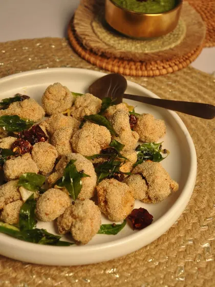My Prawn 65 is a spicy and flavorful appetizer. The prawns are marinated in a blend of South Indian spices and fried with curry leaves and chilies.